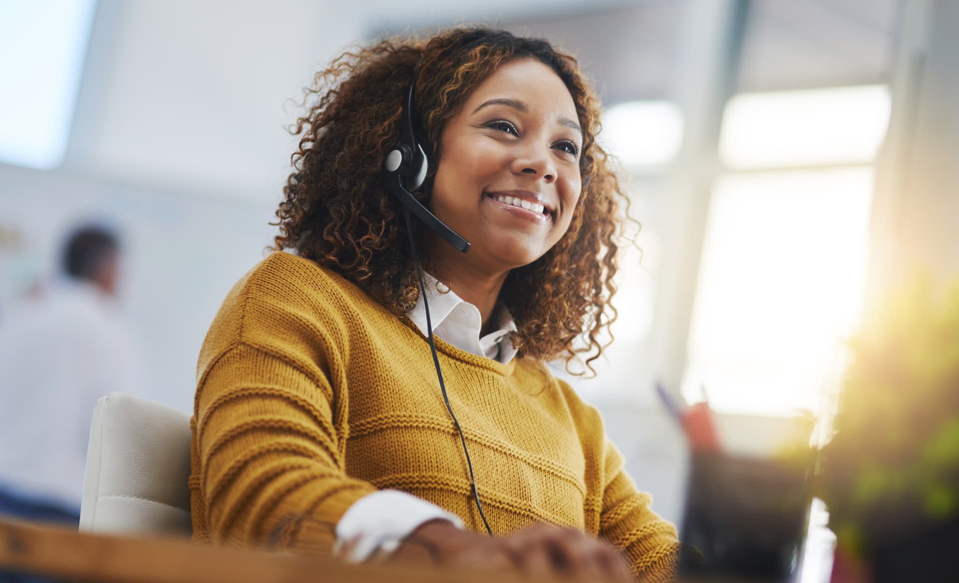 A friendly IslandNet customer service professional wearing a headset